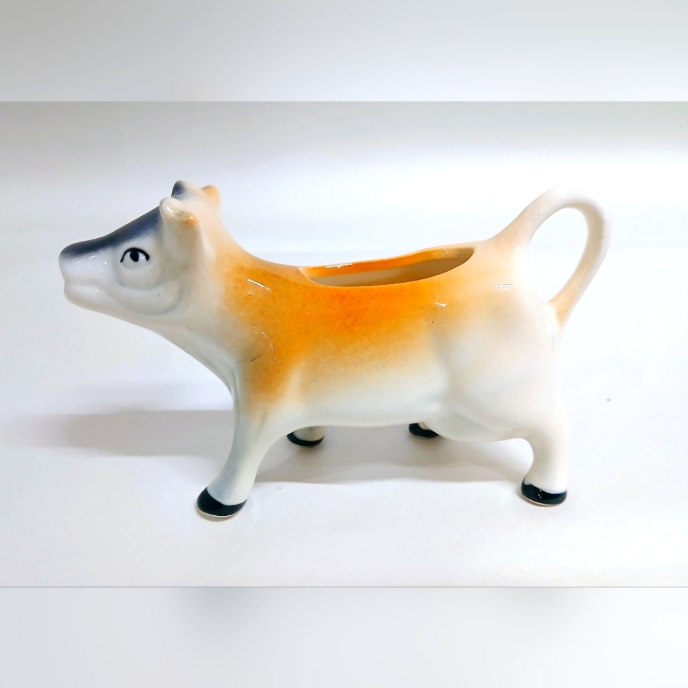 Vintage Ceramic Cow Creamer in Orange and White